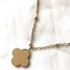 Arrière collier pendentif doré petite fleur 4 pétales boutique bijoux-harmonie Arrière collier pendentif doré petite fleur 4 pétales