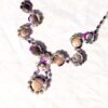 Arrière parure bijoux multiples fleurs mauves différentes tailles