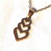 Collier pendentif triple coeurs entassés