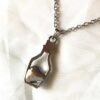 Arrière collier pendentif argenté petite bouteille coeur bleu fond amour