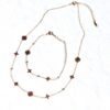 Parure bijoux dorés étoiles cercles fleurs losanges pierres rondes